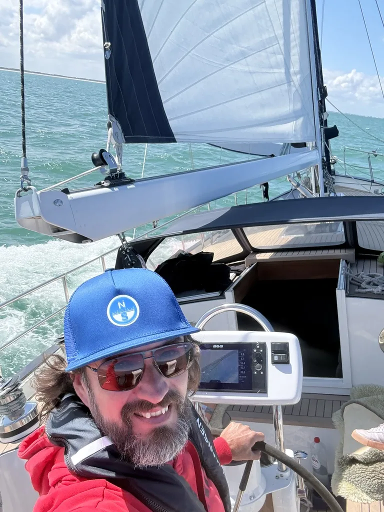 Sybren Smith at the helm of his sailing yacht Cedo Nulli